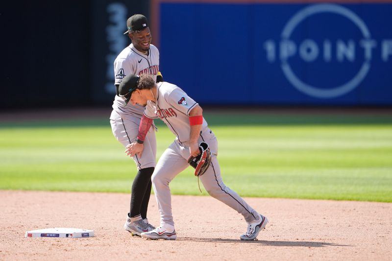 May 1, 2025; New York City, New York, USA; Arizona Diamondbacks center fielder Alek Thomas (5) taps shortstop Geraldo Perdomo (2) on the leg to celebrate the victory against the New York Mets after during the ninth inning at Citi Field. Mandatory Credit: Gregory Fisher-Imagn Images