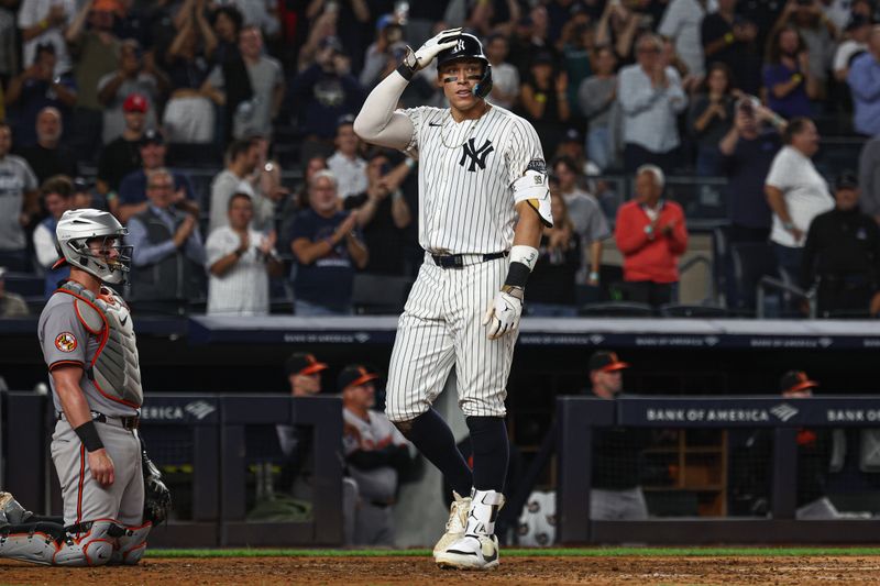 Sep 26, 2024; Bronx, New York, USA; New York Yankees center fielder Aaron Judge (99) celebrates after hitting a two run home run during the seventh inning against the Baltimore Orioles at Yankee Stadium. Mandatory Credit: Vincent Carchietta-Imagn Images