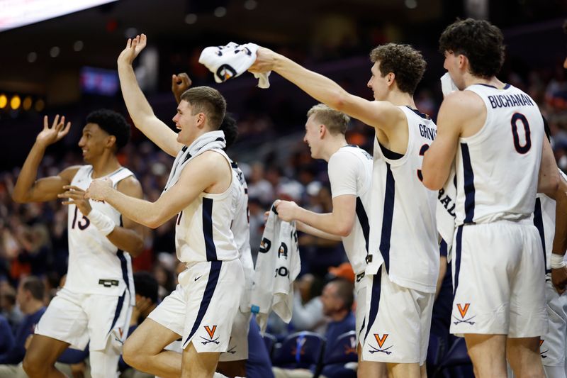 Dec 2, 2023; Charlottesville, Virginia, USA; Virginia Cavaliers players celebrate on the bench against the Syracuse Orange in the closing minute during the second half at John Paul Jones Arena. Mandatory Credit: Geoff Burke-USA TODAY Sports