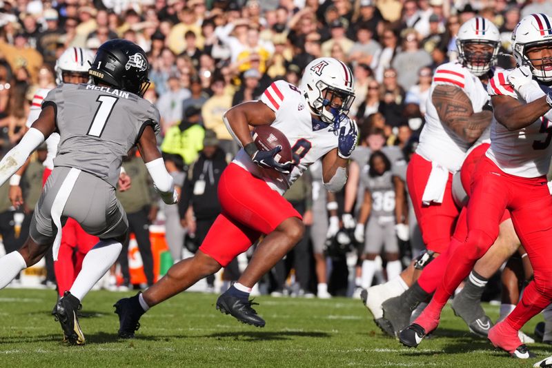 Nov 11, 2023; Boulder, Colorado, USA; Arizona Wildcats running back DJ Williams (8) carries the ball in the second half against the Colorado Buffaloes at Folsom Field. Mandatory Credit: Ron Chenoy-USA TODAY Sports