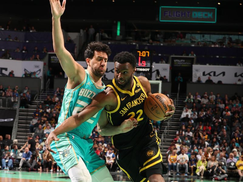 CHARLOTTE, NC - MARCH 29: Andrew Wiggins #22 of the Golden State Warriors handles the ball during the game against the Charlotte Hornets on March 29, 2024 at Spectrum Center in Charlotte, North Carolina. NOTE TO USER: User expressly acknowledges and agrees that, by downloading and or using this photograph, User is consenting to the terms and conditions of the Getty Images License Agreement. Mandatory Copyright Notice: Copyright 2024 NBAE (Photo by Kent Smith/NBAE via Getty Images)