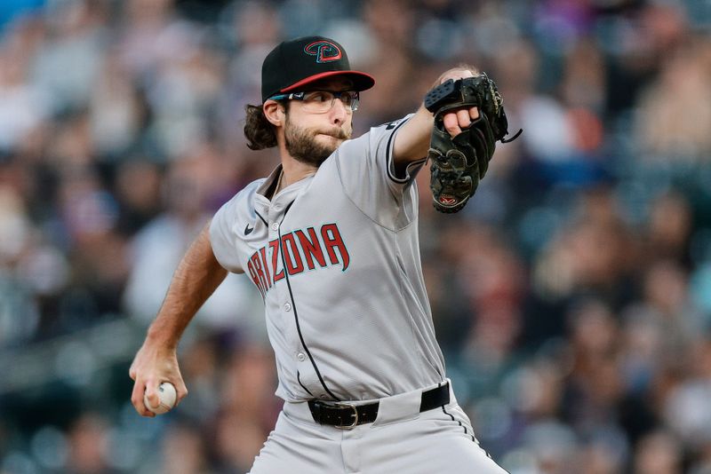 Apr 8, 2024; Denver, Colorado, USA; Arizona Diamondbacks starting pitcher Zac Gallen (23) pitches in the second inning against the Colorado Rockies at Coors Field. Mandatory Credit: Isaiah J. Downing-USA TODAY Sports