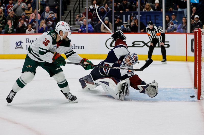 Mar 8, 2024; Denver, Colorado, USA; Minnesota Wild right wing Mats Zuccarello (36) shoots wide on a penalty shot against Colorado Avalanche goaltender Alexandar Georgiev (40) in the third period at Ball Arena. Mandatory Credit: Isaiah J. Downing-USA TODAY Sports