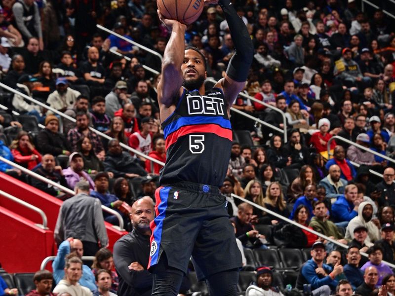 DETROIT, MI - NOVEMBER 12: Malik Beasley #5 of the Detroit Pistons shoots a three point basket during the game against the Miami Heat during the Emirates NBA Cup game on November 12, 2024 at Little Caesars Arena in Detroit, Michigan. NOTE TO USER: User expressly acknowledges and agrees that, by downloading and/or using this photograph, User is consenting to the terms and conditions of the Getty Images License Agreement. Mandatory Copyright Notice: Copyright 2024 NBAE (Photo by Chris Schwegler/NBAE via Getty Images)