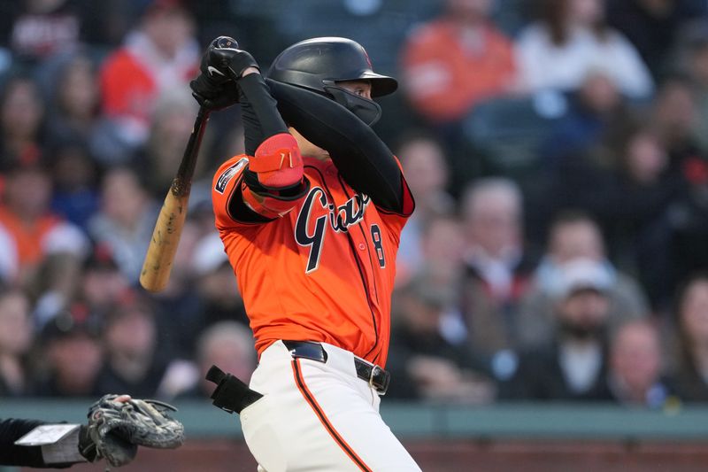 Apr 26, 2024; San Francisco, California, USA; San Francisco Giants leftfielder Michael Conforto (8) hits a single against the Pittsburgh Pirates during the second inning at Oracle Park. Mandatory Credit: Darren Yamashita-USA TODAY Sports