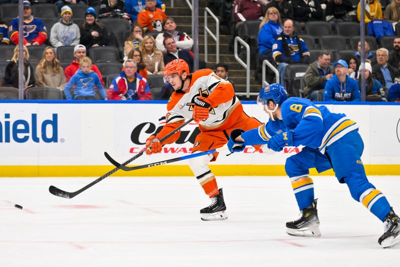 Dec 1, 2025; St. Louis, Missouri, USA; Anaheim Ducks right wing Troy Terry (19) shoots as St. Louis Blues defenseman Philip Broberg (6) defends during the first period at Enterprise Center. Mandatory Credit: Jeff Curry-Imagn Images