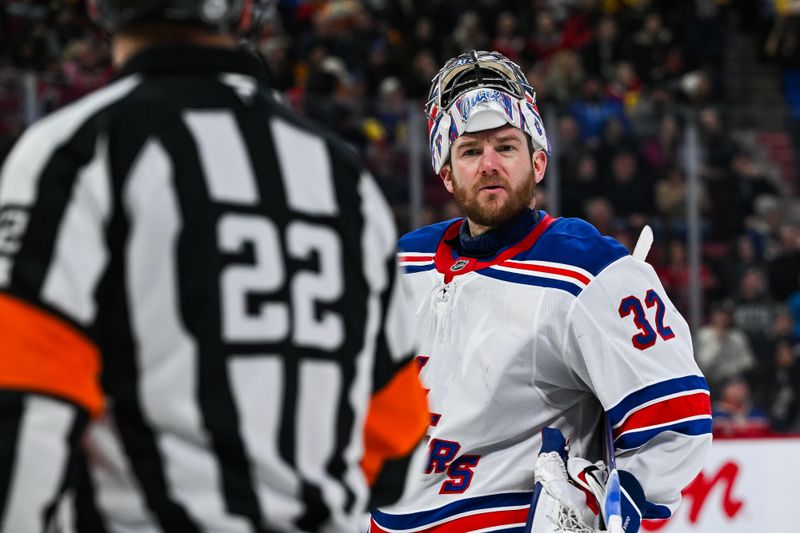 Jan 19, 2025; Montreal, Quebec, CAN; New York Rangers goalie Jonathan Quick (32) argues with NHL referee Ghislain Hebert (22) against the Montreal Canadiens during the second period at Bell Centre. Mandatory Credit: David Kirouac-Imagn Images