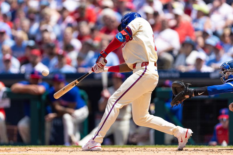 May 8, 2024; Philadelphia, Pennsylvania, USA; Philadelphia Phillies outfielder Johan Rojas (18) hits a single during the third inning against the Toronto Blue Jays at Citizens Bank Park. Mandatory Credit: Bill Streicher-USA TODAY Sports