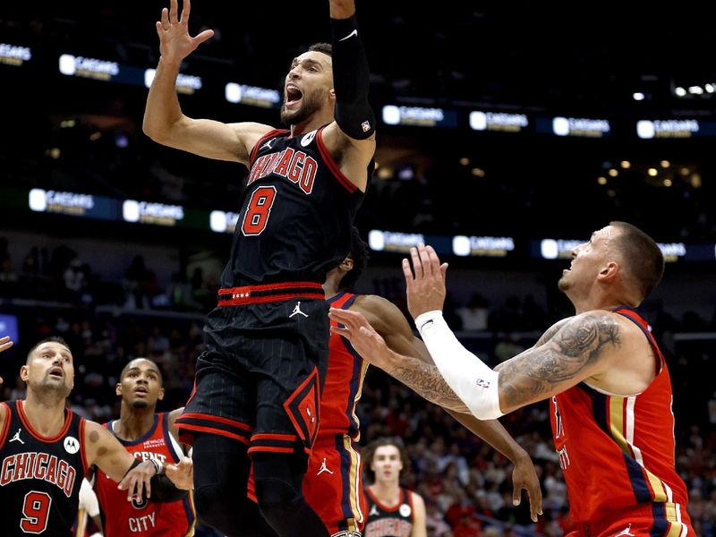 NEW ORLEANS, LOUISIANA - OCTOBER 23: Zach LaVine #8 of the Chicago Bulls is stripped of the ball by Daniel Theis #10 of the New Orleans Pelicans during the first quarter of an NBA game at Smoothie King Center on October 23, 2024 in New Orleans, Louisiana. NOTE TO USER: User expressly acknowledges and agrees that, by downloading and or using this photograph, User is consenting to the terms and conditions of the Getty Images License Agreement. (Photo by Sean Gardner/Getty Images)