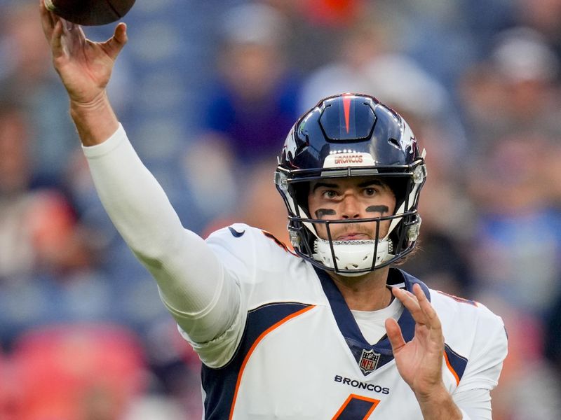 Denver Broncos quarterback Jarrett Stidham (4) passes against the Los Angeles Rams during a preseason NFL football game Saturday, Aug. 26, 2023, in Denver. (AP Photo/Jack Dempsey)