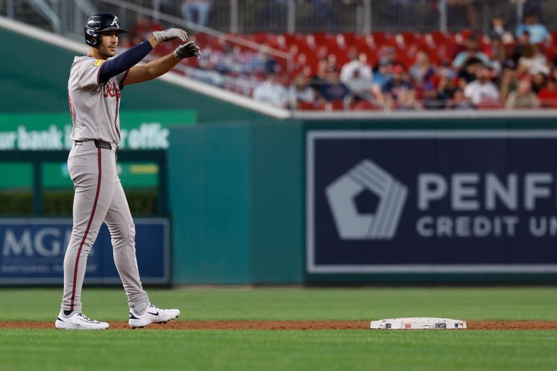 Sep 10, 2024; Washington, District of Columbia, USA; Atlanta Braves first baseman Matt Olson (28) gestures at second base after hitting an RBI double against the Washington Nationals during the third inning at Nationals Park. Mandatory Credit: Geoff Burke-Imagn Images