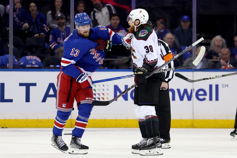 Oct 16, 2023; New York, New York, USA; New York Rangers left wing Alexis Lafreniere (13) and Arizona Coyotes center Liam O'Brien (38) exchange words during the second period at Madison Square Garden. Mandatory Credit: Brad Penner-USA TODAY Sports