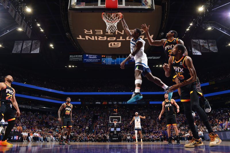 PHOENIX, AZ - APRIL 4: Anthony Edwards #5 of the Minnesota Timberwolves dunks the ball during the game against the Phoenix Suns during Round 1 Game 4 of the 2024 NBA Playoffs on April 4, 2023 at Footprint Center in Phoenix, Arizona. NOTE TO USER: User expressly acknowledges and agrees that, by downloading and or using this photograph, user is consenting to the terms and conditions of the Getty Images License Agreement. Mandatory Copyright Notice: Copyright 2024 NBAE (Photo by Barry Gossage/NBAE via Getty Images)