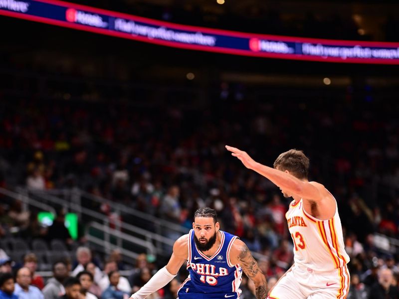 ATLANTA, GA - OCTOBER 14:  Caleb Martin #16 of the Philadelphia 76ers dribbles the ball during the game against the Atlanta Hawks  during a preseason game on October 14, 2024 at State Farm Arena in Atlanta, Georgia.  NOTE TO USER: User expressly acknowledges and agrees that, by downloading and/or using this Photograph, user is consenting to the terms and conditions of the Getty Images License Agreement. Mandatory Copyright Notice: Copyright 2024 NBAE (Photo by Adam Hagy/NBAE via Getty Images)