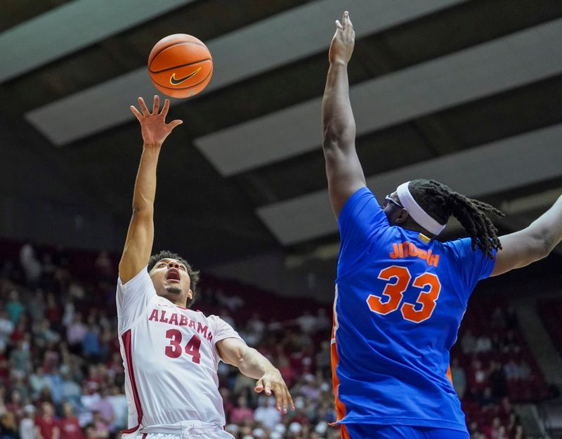 Feb 8, 2023; Tuscaloosa, Alabama, USA; Alabama Crimson Tide guard Jaden Quinerly (34) shoots against Florida Gators center Jason Jitoboh (33) during the second half at Coleman Coliseum. Mandatory Credit: Marvin Gentry-USA TODAY Sports