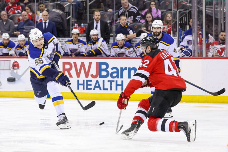 Mar 7, 2024; Newark, New Jersey, USA; St. Louis Blues defenseman Colton Parayko (55) shoots the puck as New Jersey Devils center Curtis Lazar (42) defends during the second period at Prudential Center. Mandatory Credit: Vincent Carchietta-USA TODAY Sports