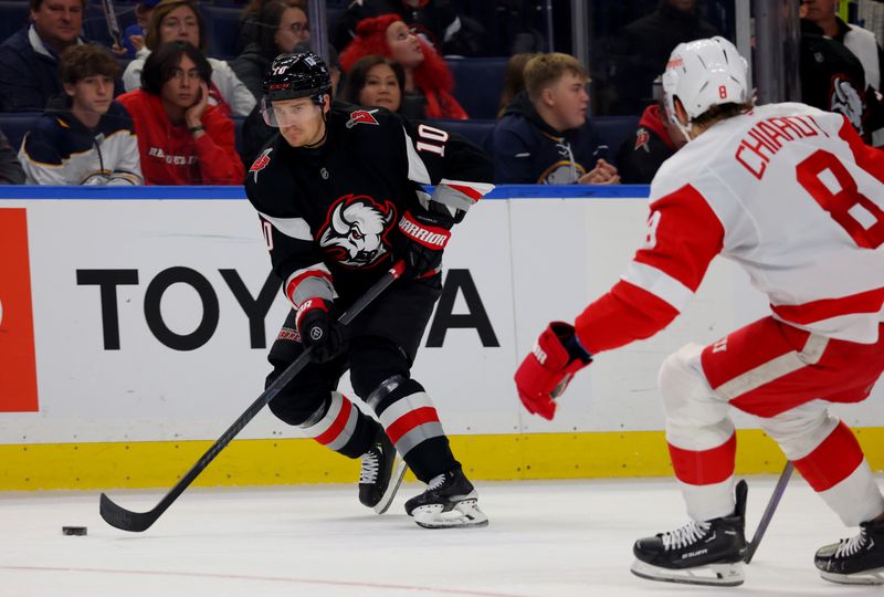 Oct 26, 2024; Buffalo, New York, USA;  Buffalo Sabres defenseman Henri Jokiharju (10) skates up ice with the puck during the second period against the Detroit Red Wings at KeyBank Center. Mandatory Credit: Timothy T. Ludwig-Imagn Images