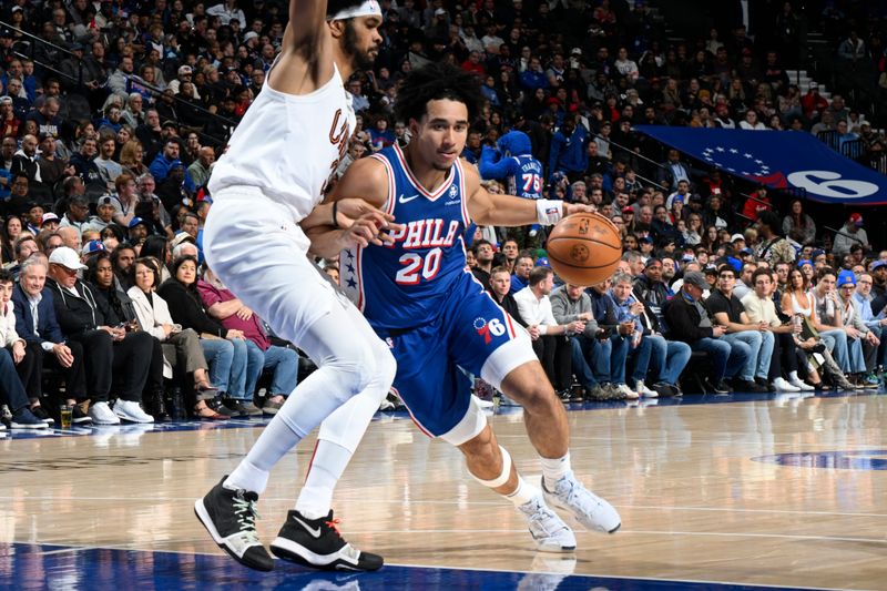 PHILADELPHIA, PA - NOVEMBER 13: Jared McCain #20 of the Philadelphia 76ers drives to the basket during the game against the Cleveland Cavaliers on November 13, 2024 at the Wells Fargo Center in Philadelphia, Pennsylvania NOTE TO USER: User expressly acknowledges and agrees that, by downloading and/or using this Photograph, user is consenting to the terms and conditions of the Getty Images License Agreement. Mandatory Copyright Notice: Copyright 2024 NBAE (Photo by David Dowt/NBAE via Getty Images)