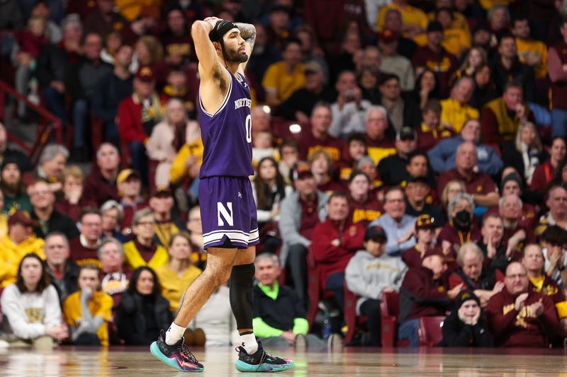 Feb 3, 2024; Minneapolis, Minnesota, USA; Northwestern Wildcats guard Boo Buie (0) reacts during overtime against the Minnesota Golden Gophers at Williams Arena. Mandatory Credit: Matt Krohn-USA TODAY Sports