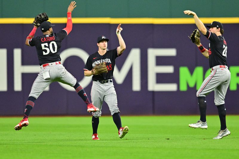 Sep 5, 2023; Cleveland, Ohio, USA; Minnesota Twins left fielder Willi Castro (50) and center fielder Andrew Stevenson (45) and right fielder Max Kepler (26) celebrate after the Twins beat the Cleveland Guardians at Progressive Field. Mandatory Credit: Ken Blaze-USA TODAY Sports