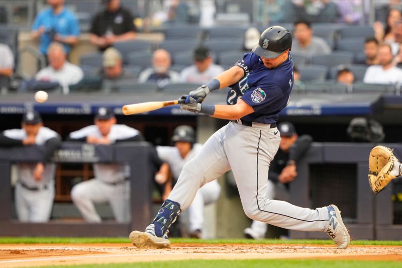 Jun 22, 2023; Bronx, New York, USA; Seattle Mariners catcher Cal Raleigh (29) hits a single against the New York Yankees  during the first inning at Yankee Stadium. Mandatory Credit: Gregory Fisher-USA TODAY Sports