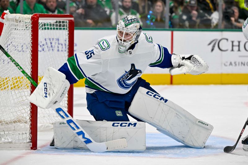 Dec 21, 2023; Dallas, Texas, USA; Vancouver Canucks goaltender Thatcher Demko (35) faces the Dallas Stars attack during the second period at the American Airlines Center. Mandatory Credit: Jerome Miron-USA TODAY Sports