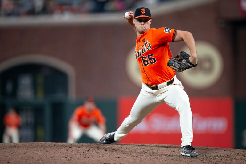 Aug 9, 2024; San Francisco, California, USA; San Francisco Giants pitcher Landon Roupp (65) delivers a pitch against the Detroit Tigers during the seventh inning at Oracle Park. Mandatory Credit: D. Ross Cameron-USA TODAY Sports