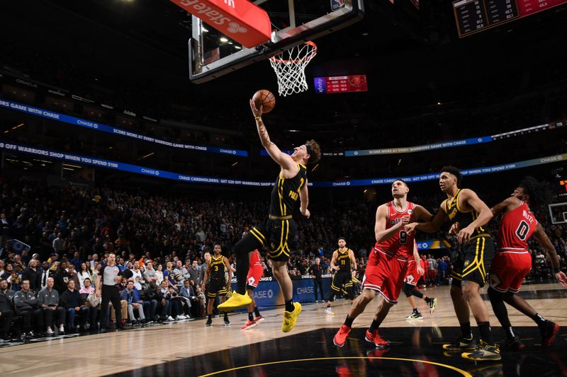 SAN FRANCISCO, CA - MARCH 7: Brandin Podziemski #2 of the Golden State Warriors drives to the basket during the game against the Chicago Bulls on March 7, 2024 at Chase Center in San Francisco, California. NOTE TO USER: User expressly acknowledges and agrees that, by downloading and or using this photograph, user is consenting to the terms and conditions of Getty Images License Agreement. Mandatory Copyright Notice: Copyright 2024 NBAE (Photo by Noah Graham/NBAE via Getty Images)