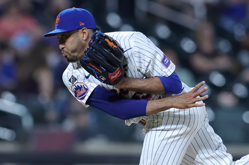 Jun 13, 2024; New York City, New York, USA; New York Mets relief pitcher Edwin Diaz (39) follows through on a pitch against the Miami Marlins during the ninth inning at Citi Field. Mandatory Credit: Brad Penner-USA TODAY Sports