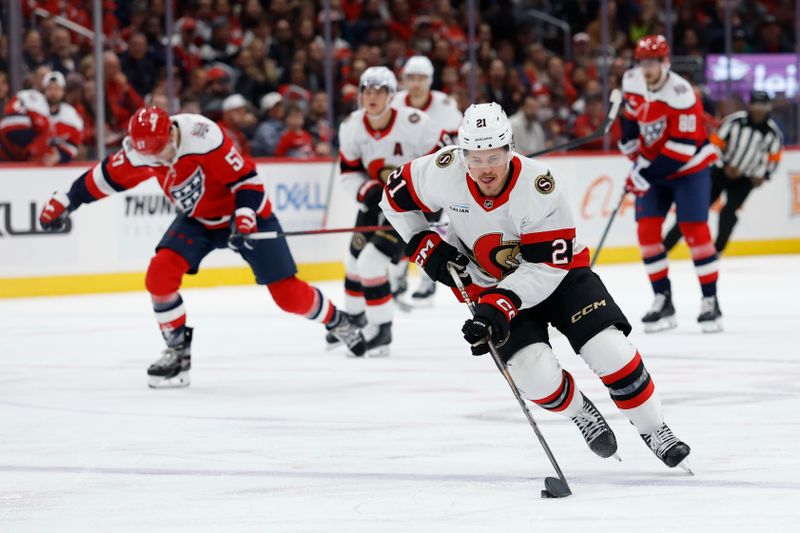 Oct 25, 2025; Washington, District of Columbia, USA; Ottawa Senators center Nick Cousins (21) skates with the puck against as Washington Capitals defenseman Trevor van Riemsdyk (57) chases during the second period at Capital One Arena. Mandatory Credit: Geoff Burke-Imagn Images