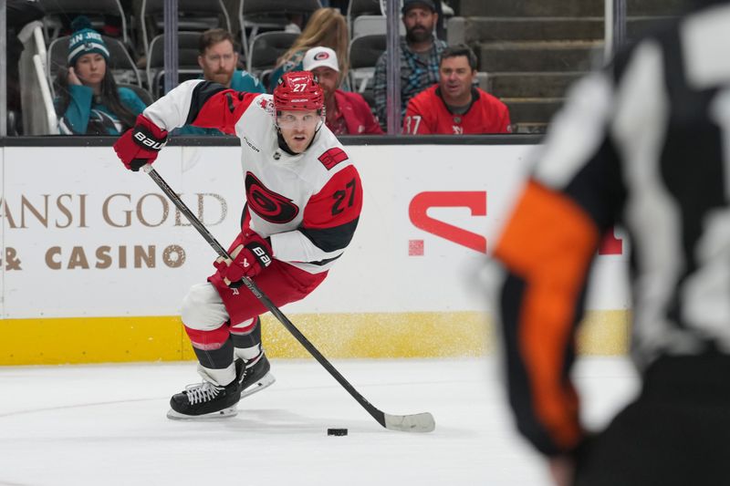 Oct 14, 2025; San Jose, California, USA;  Carolina Hurricanes left wing Nikolaj Ehlers (27) looks to pass the puck during the second period against the San Jose Sharks at SAP Center at San Jose. Mandatory Credit: Stan Szeto-Imagn Images