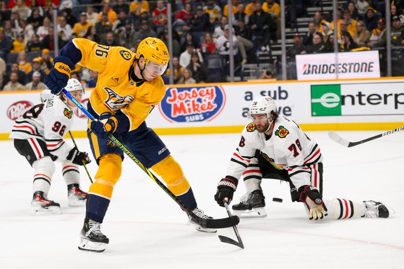 Jan 16, 2025; Nashville, Tennessee, USA;  Chicago Blackhawks defenseman TJ Brodie (78) blocks the shot of of Nashville Predators defenseman Brady Skjei (76) during the third period at Bridgestone Arena. Mandatory Credit: Steve Roberts-Imagn Images