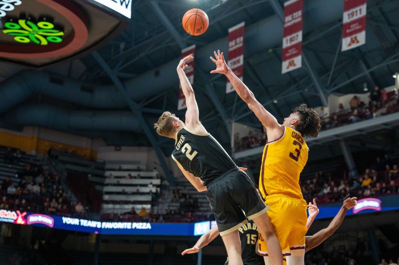 Jan 19, 2023; Minneapolis, Minnesota, USA; Purdue Boilermakers guard Fletcher Loyer (2) shoots over Minnesota Golden Gophers forward Dawson Garcia (3) in the second half at Williams Arena. Mandatory Credit: Matt Blewett-USA TODAY Sports