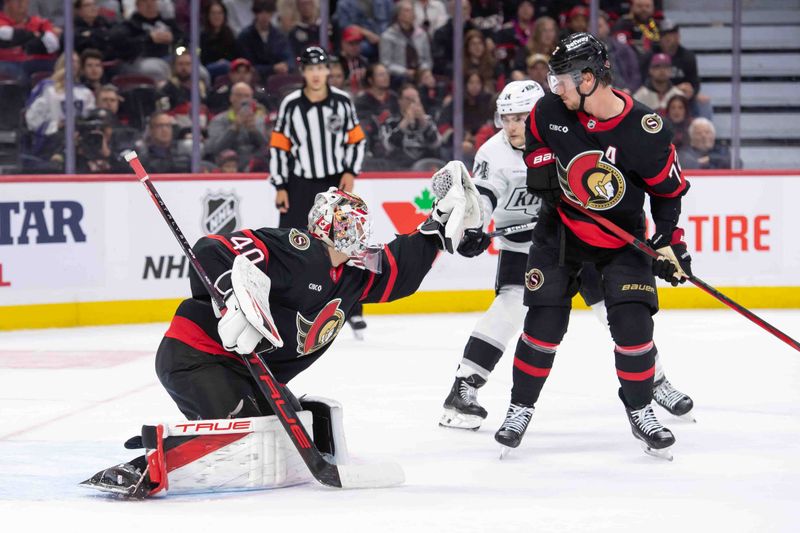 Oct 14, 2024; Ottawa, Ontario, CAN; Ottawa Senators goalie Mads Sogaard (40) makes a save in front of Los Angeles Kings right wing Alex Lafreniere (14) in the second period at the Canadian Tire Centre. Mandatory Credit: Marc DesRosiers-Imagn Images