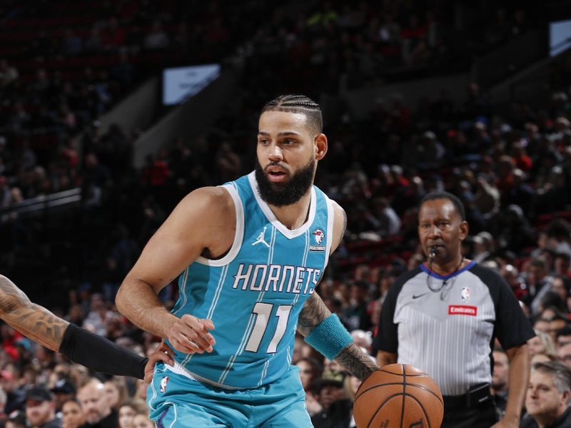 PORTLAND, OR - FEBRUARY 25:  Cody Martin #11 of the Charlotte Hornets handles the ball during the game  on February 25, 2024 at the Moda Center Arena in Portland, Oregon. NOTE TO USER: User expressly acknowledges and agrees that, by downloading and or using this photograph, user is consenting to the terms and conditions of the Getty Images License Agreement. Mandatory Copyright Notice: Copyright 2024 NBAE (Photo by Cameron Browne/NBAE via Getty Images)