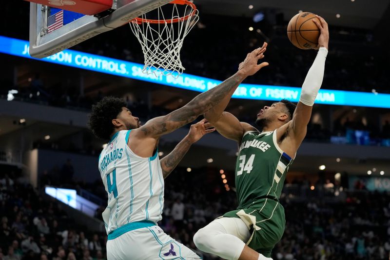 MILWAUKEE, WISCONSIN - FEBRUARY 27: Giannis Antetokounmpo #34 of the Milwaukee Bucks shoots the ball against Nick Richards #4 of the Charlotte Hornets during the second half at Fiserv Forum on February 27, 2024 in Milwaukee, Wisconsin. NOTE TO USER: User expressly acknowledges and agrees that, by downloading and or using this photograph, User is consenting to the terms and conditions of the Getty Images License Agreement. (Photo by Patrick McDermott/Getty Images)