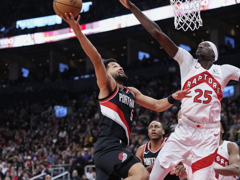 TORONTO, ON - OCTOBER 30: Skylar Mays #5 of the Portland Trail Blazers goes to the basket against Chris Boucher #25 of the Toronto Raptors during the first half of the game at the Scotiabank Arena on October 30, 2023 in Toronto, Ontario, Canada. NOTE TO USER: User expressly acknowledges and agrees that, by downloading and/or using this Photograph, user is consenting to the terms and conditions of the Getty Images License Agreement. (Photo by Mark Blinch/Getty Images)