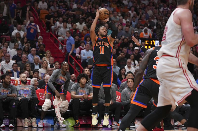 MIAMI, FLORIDA - MARCH 03: Jalen Brunson #11 of the New York Knicks attempts a three point shot during the first half against the Miami Heat at Miami-Dade Arena on March 03, 2023 in Miami, Florida. NOTE TO USER: User expressly acknowledges and agrees that,? by downloading and or using this photograph,? User is consenting to the terms and conditions of the Getty Images License Agreement. (Photo by Eric Espada/Getty Images)