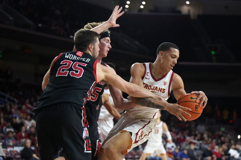 January 14, 2023; Los Angeles, California, USA; Southern California Trojans forward Kobe Johnson (0) battles for the ball with Utah Utes guard Rollie Worster (25) and center Branden Carlson (35) in the second half at Galen Center. Mandatory Credit: Kirby Lee-USA TODAY Sports