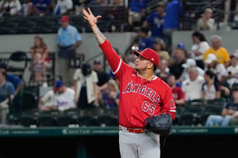 Sep 6, 2024; Arlington, Texas, USA; Los Angeles Angels pitcher José Quijada (65) reacts after final out of the game against the Texas Rangers at Globe Life Field. Mandatory Credit: Raymond Carlin III-Imagn Images