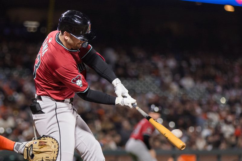May 13, 2025; San Francisco, California, USA; Arizona Diamondbacks center fielder Tim Tawa (13) hits a single against the San Francisco Giants during the eighth inning at Oracle Park. Mandatory Credit: John Hefti-Imagn Images