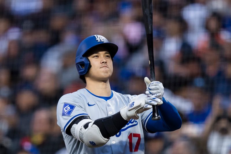 May 15, 2024; San Francisco, California, USA; Los Angeles Dodgers designated hitter Shohei Ohtani (17) on deck before batting against the San Francisco Giants during the fifth inning at Oracle Park. Mandatory Credit: John Hefti-USA TODAY Sports