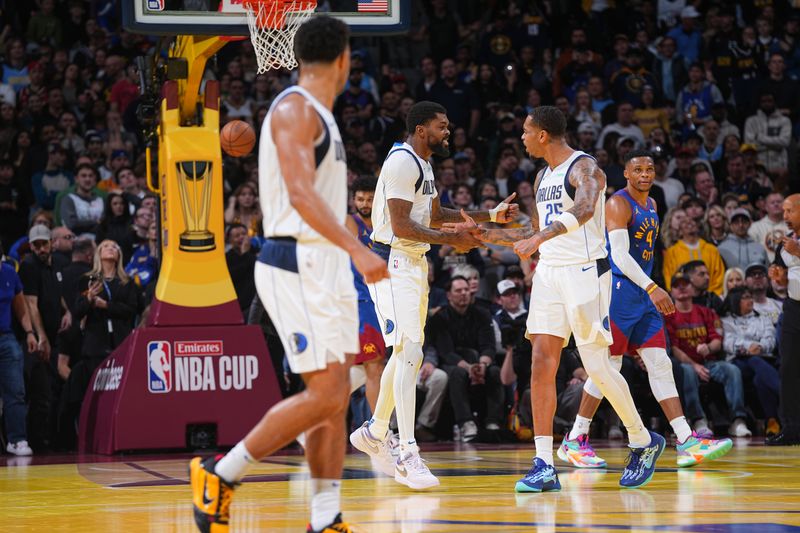 DENVER, CO - NOVEMBER 22: Naji Marshall #13  and P.J Washington #25 of the Dallas Mavericks high five during the game against the Denver Nuggets  during the Emirates NBA Cup game on November 22, 2024 at Ball Arena in Denver, Colorado. NOTE TO USER: User expressly acknowledges and agrees that, by downloading and/or using this Photograph, user is consenting to the terms and conditions of the Getty Images License Agreement. Mandatory Copyright Notice: Copyright 2024 NBAE (Photo by Bart Young/NBAE via Getty Images)