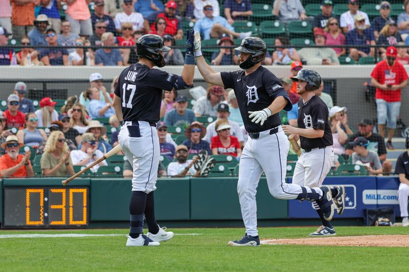 Feb 27, 2025; Lakeland, Florida, USA; Detroit Tigers catcher Jake Rogers (34) celebrates with third baseman Jace Jung (17) after hitting a home run during the fourth inning against the Boston Red Sox at Publix Field at Joker Marchant Stadium. Mandatory Credit: Mike Watters-Imagn Images