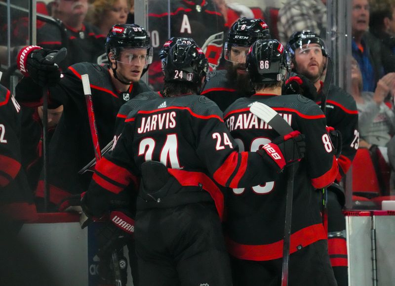 Apr 22, 2024; Raleigh, North Carolina, USA; Carolina Hurricanes defenseman Brent Burns (8) right wing Stefan Noesen (23), left wing Teuvo Teravainen (86), center Seth Jarvis (24) and center Jake Guentzel (59) talk against the New York Islanders during the second period in game two of the first round of the 2024 Stanley Cup Playoffs at PNC Arena. Mandatory Credit: James Guillory-USA TODAY Sports