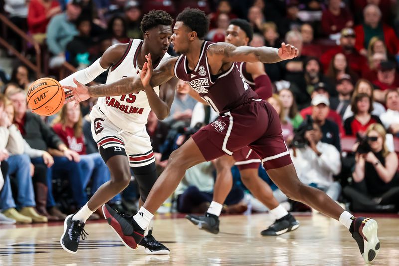 Jan 6, 2024; Columbia, South Carolina, USA; Mississippi State Bulldogs guard Dashawn Davis (10) steals the ball from South Carolina Gamecocks guard Morris Ugusuk (15) in the second half at Colonial Life Arena. Mandatory Credit: Jeff Blake-USA TODAY Sports