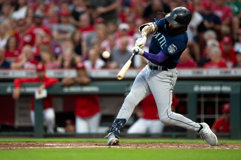 Sep 6, 2023; Cincinnati, Ohio, USA; Seattle Mariners shortstop J.P. Crawford (3) hits a three-run home run in the fourth inning of the MLB baseball game between the Cincinnati Reds and the Seattle Mariners at Great American Ball Park. Mandatory Credit: Albert Cesare-USA TODAY Sports