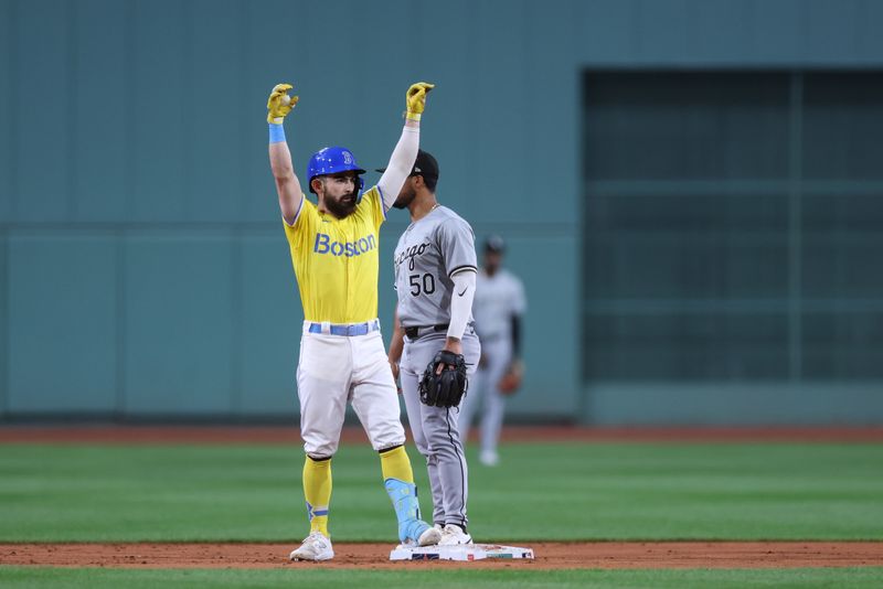 Sep 7, 2024; Boston, Massachusetts, USA; Boston Red Sox first baseman Connor Wong (12) celebrates after hitting an RBI double during the first inning against the Chicago White Sox at Fenway Park. Mandatory Credit: Paul Rutherford-Imagn Images