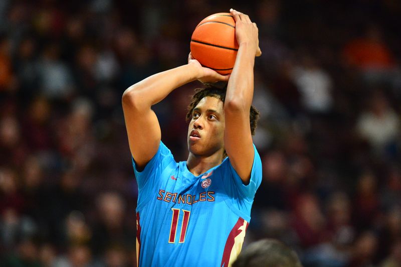 Feb 13, 2024; Blacksburg, Virginia, USA;  Florida State Seminoles forward Baba Miller (11)  shoots a free throw during the first half at Cassell Coliseum. Mandatory Credit: Brian Bishop-USA TODAY Sports