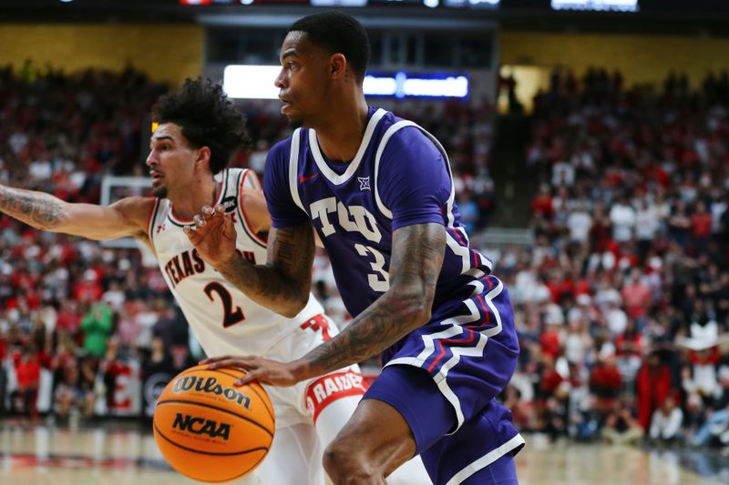 Feb 20, 2024; Lubbock, Texas, USA;  TCU Horned Frogs guard Avery Anderson III (3) drives the ball against Texas Tech Red Raiders guard Pop Isaacs (2) in the first half at United Supermarkets Arena. Mandatory Credit: Michael C. Johnson-USA TODAY Sports